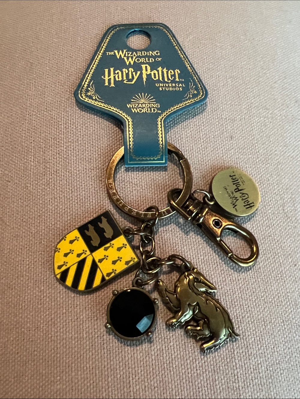 Universal Studios Harry Potter House of Hufflepuff Badger Logo Metal Key Chain